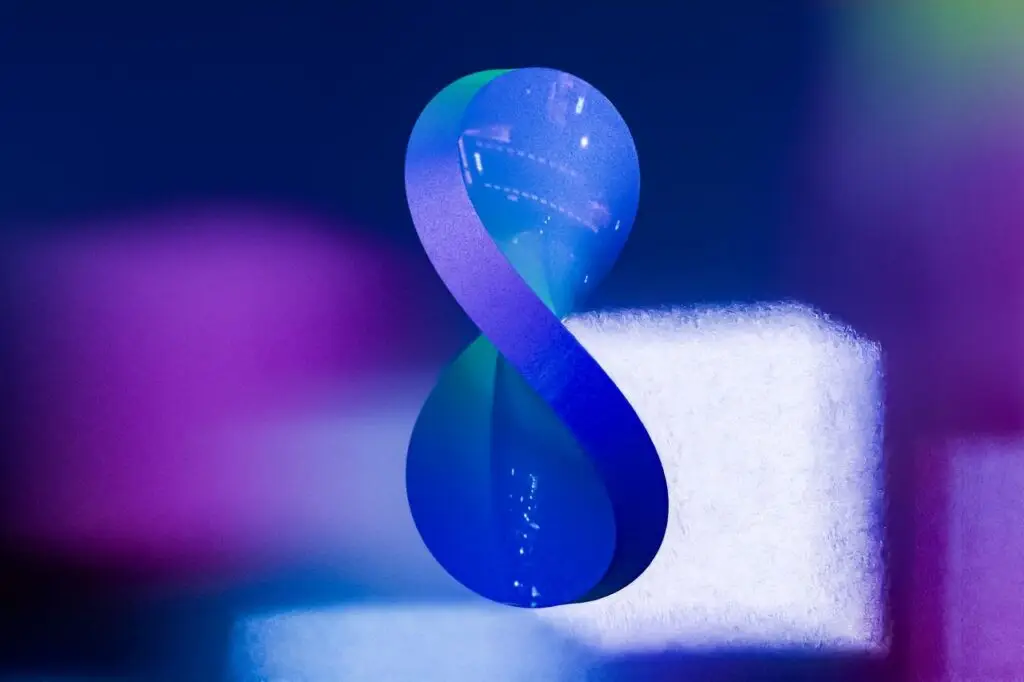 Vibrant abstract infinity symbol with soft focus and gradient colors.